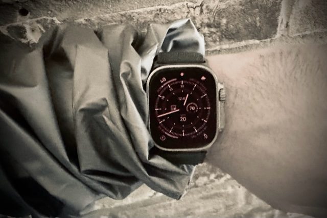 Apple Watch Ultra on a wrist, activity rings partly closed
